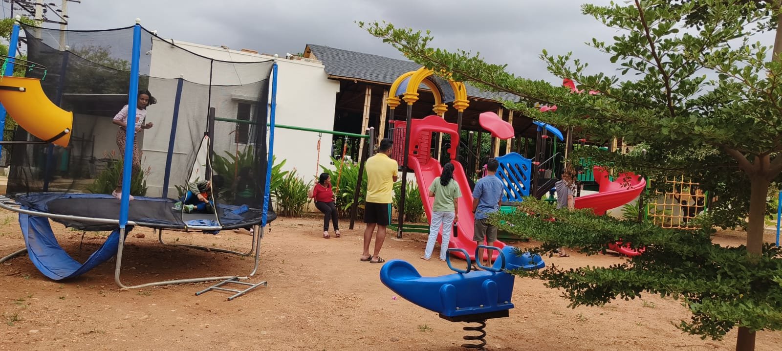 Children's play area with slides and trampoline